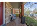 Cozy covered front porch with comfortable seating and decorative accents, perfect for relaxing outdoors at 3354 Vallejo St, Denver, CO 80211