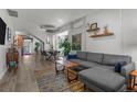 Bright and spacious living room with a comfortable gray sectional, open layout, and modern decor at 3354 Vallejo St, Denver, CO 80211