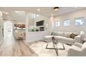 Comfortable living room with wood floors and neutral tones, creating an inviting atmosphere at 1960 E 166Th Dr, Thornton, CO 80602