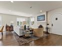 Bright living room with hardwood floors, fireplace, and stylish furnishings at 1024 S Columbine St, Denver, CO 80209