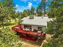 Aerial view of a home with a spacious deck, perfect for entertaining and enjoying the surrounding nature at 997 Dogwood Dr, Golden, CO 80401