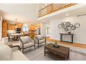 Spacious living room with high ceilings, hardwood floors, and a fireplace at 11729 Elmer Linn Dr, Longmont, CO 80504