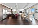 Bright, open living space featuring hardwood floors, a modern kitchen, and a dining area with views at 4200 W 17Th Ave # 912, Denver, CO 80204