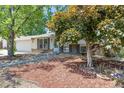 Charming home with a well-maintained lawn and mature trees creating a welcoming curb appeal at 359 S 25Th Ave, Brighton, CO 80601