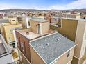 Modern townhomes with rooftop patios offer stunning city and mountain views at 2415 Java Dr, Castle Rock, CO 80109
