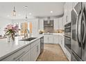 Modern kitchen featuring white cabinets, stainless appliances, and a large island, perfect for cooking and gathering with others at 2415 Java Dr, Castle Rock, CO 80109