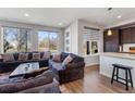 Inviting living room with large windows and modern decor at 5110 E 64Th Ave, Commerce City, CO 80022