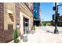 Exterior view of building entrance with modern glass addition alongside historic brickwork at 1863 Wazee St # 4B, Denver, CO 80202