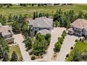 This aerial view highlights the home's manicured yard, tiled roof, and generous spacing from neighboring houses at 5665 Vistancia Ct, Parker, CO 80134