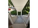 Exterior staircase providing access to upper-level condos, featuring sturdy construction at 12478 W Nevada Pl # 207, Lakewood, CO 80228