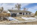 Newly remodeled home with a modern exterior and landscaping at 4501 S Lipan Ct, Englewood, CO 80110