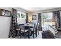 Dining area with table and chairs near a window at 7020 Avrum Dr, Denver, CO 80221