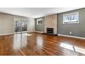 Bright living room with hardwood floors and sliding doors at 770 S Arbutus St, Lakewood, CO 80228