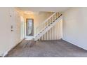 Bright entryway featuring durable floors, a staircase, and natural light at 3706 S Fairplay Way, Aurora, CO 80014
