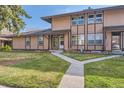 Charming townhouse featuring well-manicured lawn and inviting curb appeal at 3706 S Fairplay Way, Aurora, CO 80014