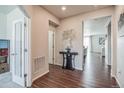 Bright and spacious entryway with wood-look floors and access to other rooms at 4245 S Nepal Cir, Aurora, CO 80013