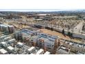 Aerial view of apartment buildings, highways, and surrounding city landscape at 1438 Little Raven St # 407, Denver, CO 80202