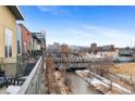 Balcony view overlooking the city and a bridge over the river at 1438 Little Raven St # 407, Denver, CO 80202
