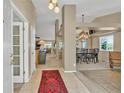 Open foyer with tile flooring and views of living and dining spaces at 10877 W 55Th Ln, Arvada, CO 80002