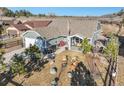 Beautiful aerial view of the home showcasing its well-maintained yard and appealing surroundings at 819 Meadow Ln, Palmer Lake, CO 80133