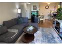 Inviting living room with cozy seating, a decorative rug, and great natural light at 2281 S Vaughn Way # 316A, Aurora, CO 80014