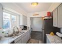 Bright kitchen featuring stainless appliances, sleek countertops, and ample cabinet space at 2080 E 84Th Ave, Denver, CO 80229