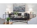 Cozy living room showcasing a modern sofa, stylish decor, and ambient lighting at 1470 S Quebec Way # 83, Denver, CO 80231
