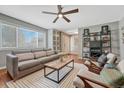 Inviting living room featuring a large window, modern furniture, and neutral décor, perfect for relaxation at 5071 S Boston St, Greenwood Village, CO 80111