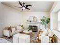 Cozy living room features a fireplace, modern furniture, and a relaxing ambiance at 1488 S Biscay Ct, Aurora, CO 80017
