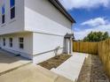 View of the yard, side and foundation of the house at 2830 E 99Th Way, Thornton, CO 80229