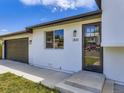 Close up of the front entrance, garage and updated features of this home at 2830 E 99Th Way, Thornton, CO 80229