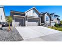 Attractive home with large driveway, stone accents and low maintenance landscaping at 5925 La Posada Pl, Parker, CO 80134