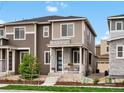 Charming two story home featuring stone accents and a cozy front porch at 5347 Warrior St, Frederick, CO 80504