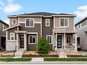 Well-kept townhome featuring two-tone siding, stone accents, and inviting front porches at 5347 Warrior St, Frederick, CO 80504
