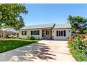 Well-kept single-story home showcasing a lush front lawn and welcoming curb appeal at 1748 W Tennessee Ave, Denver, CO 80223