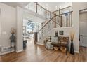 Entryway features wood floors, stairs, and access to the living room at 16231 Thunder Cat Way, Monument, CO 80132
