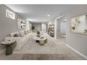 Spacious basement living room featuring carpet and a comfortable seating area at 8305 Eaton Way, Arvada, CO 80003