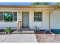 Close up of the front door and entry to this single-story home at 1225 S Honey Way, Denver, CO 80224