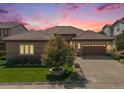 Luxury ranch home with 3-car garage and landscaped yard at 9005 Stonecrest Way, Highlands Ranch, CO 80129