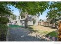 Spacious backyard with a mix of gravel, lawn, and privacy fencing at 5138 W 46Th Ave, Denver, CO 80212