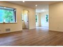 Bright living room with new flooring and large windows at 1405 S Utica St, Denver, CO 80219