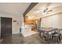 Open dining area features modern table and chairs adjacent to a compact kitchen at 430 Zang St # 4-102, Lakewood, CO 80228