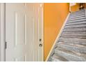 Foyer featuring a white door, and stairs with gray carpeting leading up at 9300 E Florida Ave # 906, Denver, CO 80247