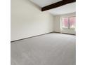 Spacious living room with carpet and a big window that brings in natural light at 8133 W Quarto Ave, Littleton, CO 80128