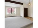 Open living room with carpet, a large window and natural light at 8133 W Quarto Ave, Littleton, CO 80128