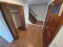 Inviting foyer with hardwood floors and a staircase leading to the upper level at 3136 S Cathay Cir, Aurora, CO 80013