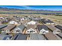 Bird's eye view of a new residential community with mountain and lake views, highlighting the area's natural beauty at 11492 Stonewash St, Littleton, CO 80125