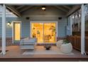 Inviting outdoor patio with stylish seating, fire pit, and sliding glass doors at 418 S Gilpin St, Denver, CO 80209