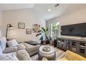 Comfortable living room featuring a large window, modern furniture, and ample natural light for a cozy atmosphere at 2841 N Columbine St, Denver, CO 80205