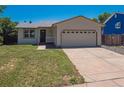 Lovely single-story home with a well-kept lawn and an attached two car garage at 1718 S Flanders Way, Aurora, CO 80017